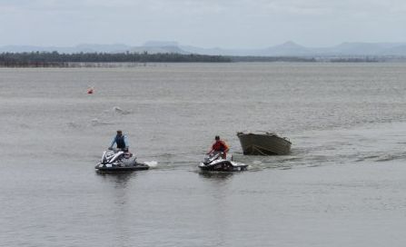Two Emerald men have been saved from their sinking boat on Fairbairn Dam today. Photo Tara Miko / CQ News Two Emerald men have been saved from their sinking boat on Fairbairn Dam today. Photo Tara Miko / CQ News